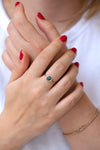Teal Sapphire Ring with Baguette Diamond Wings on Hands frontal shot 