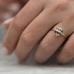Teal-Sapphire-and-Diamond-Cluster-Engagement-Ring-side-shot