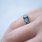 Teal Sapphire Gradient Engagement Ring Hand on WhiteSide Close.jpg
