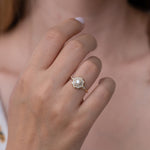 The Sun Temple Ring with Tapered Baguette Diamonds Halo