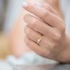 Three-Stone-Engagement-Ring-with-Half-Moon-and-Baguette-Cut-Diamonds-on-hand