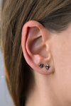 Triangle Earrings with Black and White Diamonds on ear in set 