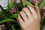 Minimalist Engagement Ring on finger