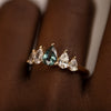 Unique-Engagement-ring-with-a-Pear-Cut-Teal-Sapphire-and-Diamonds-side-closeup