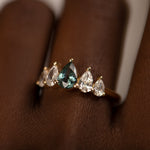 Unique-Engagement-ring-with-a-Pear-Cut-Teal-Sapphire-and-Diamonds-side-closeup
