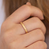Unique Geometric Wedding Ring on Hand Detail Shot