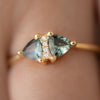 Vintage-Style-Engagement-Ring-with-Trillions-and-Brilliant-Diamonds-on-finger
