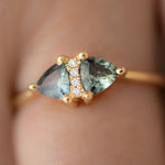 Vintage-Style-Engagement-Ring-with-Trillions-and-Brilliant-Diamonds-on-finger