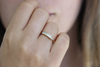 Dainty Baguette Engagement Ring on finger
