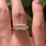 Solitaire Signet Engagement Ring with an Emerald cut Diamond