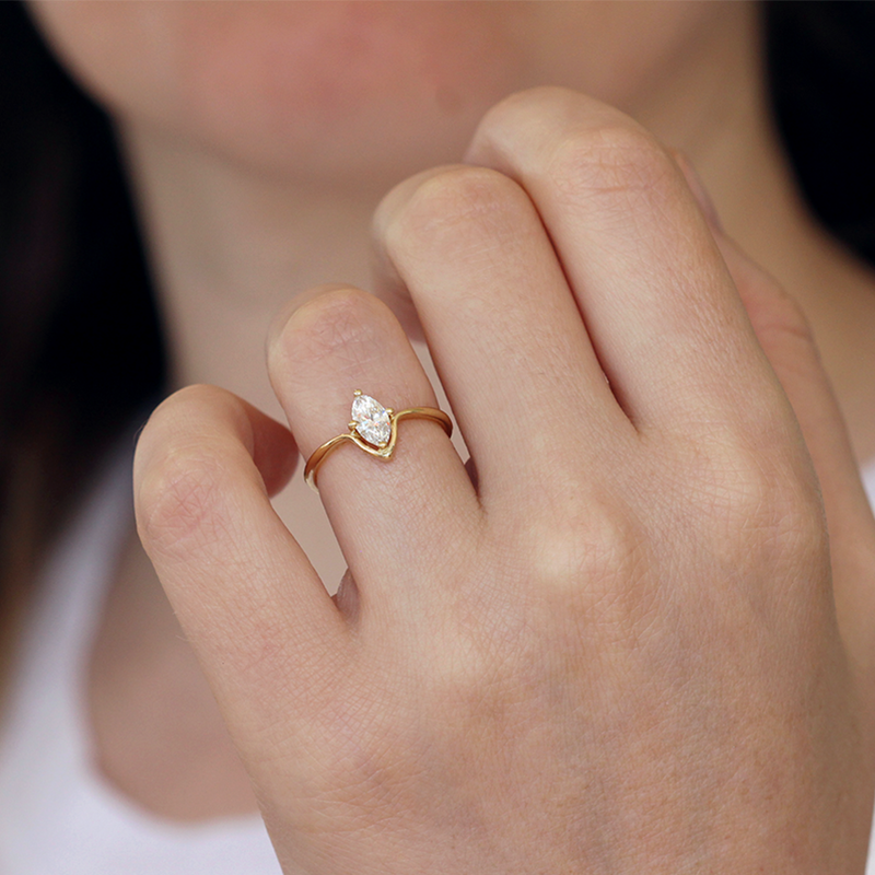 Minimalist Engagement Ring On Finger