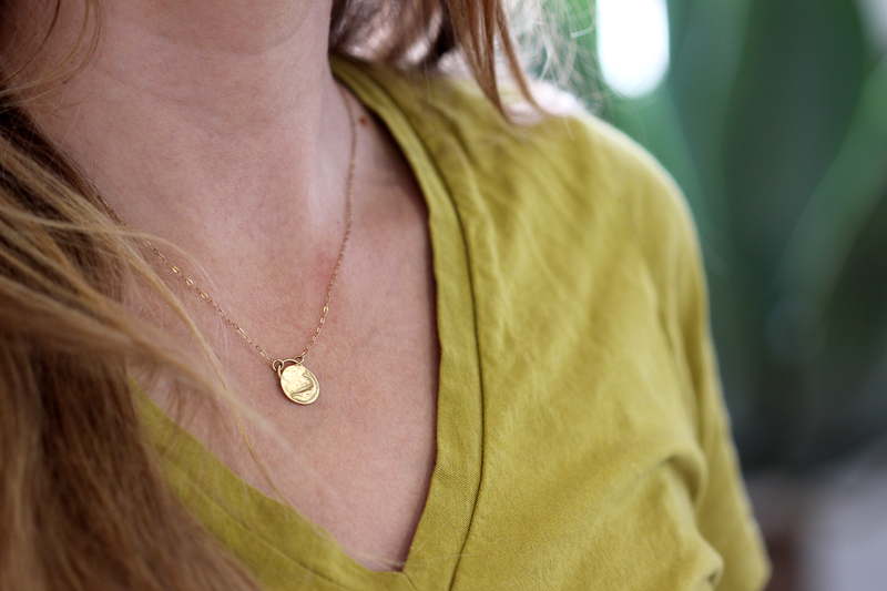 Gold Whale Necklace on a model