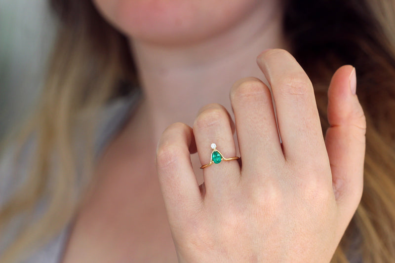 Pear Emerald Ring on finger
